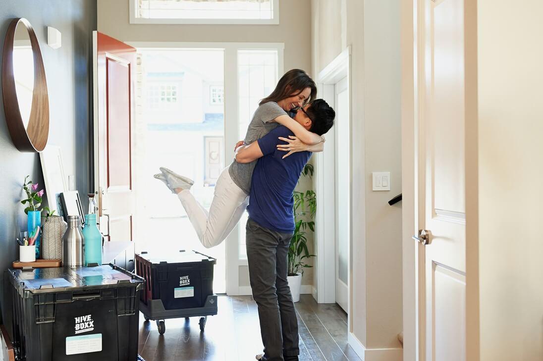 Photo of happy couple after furniture removals